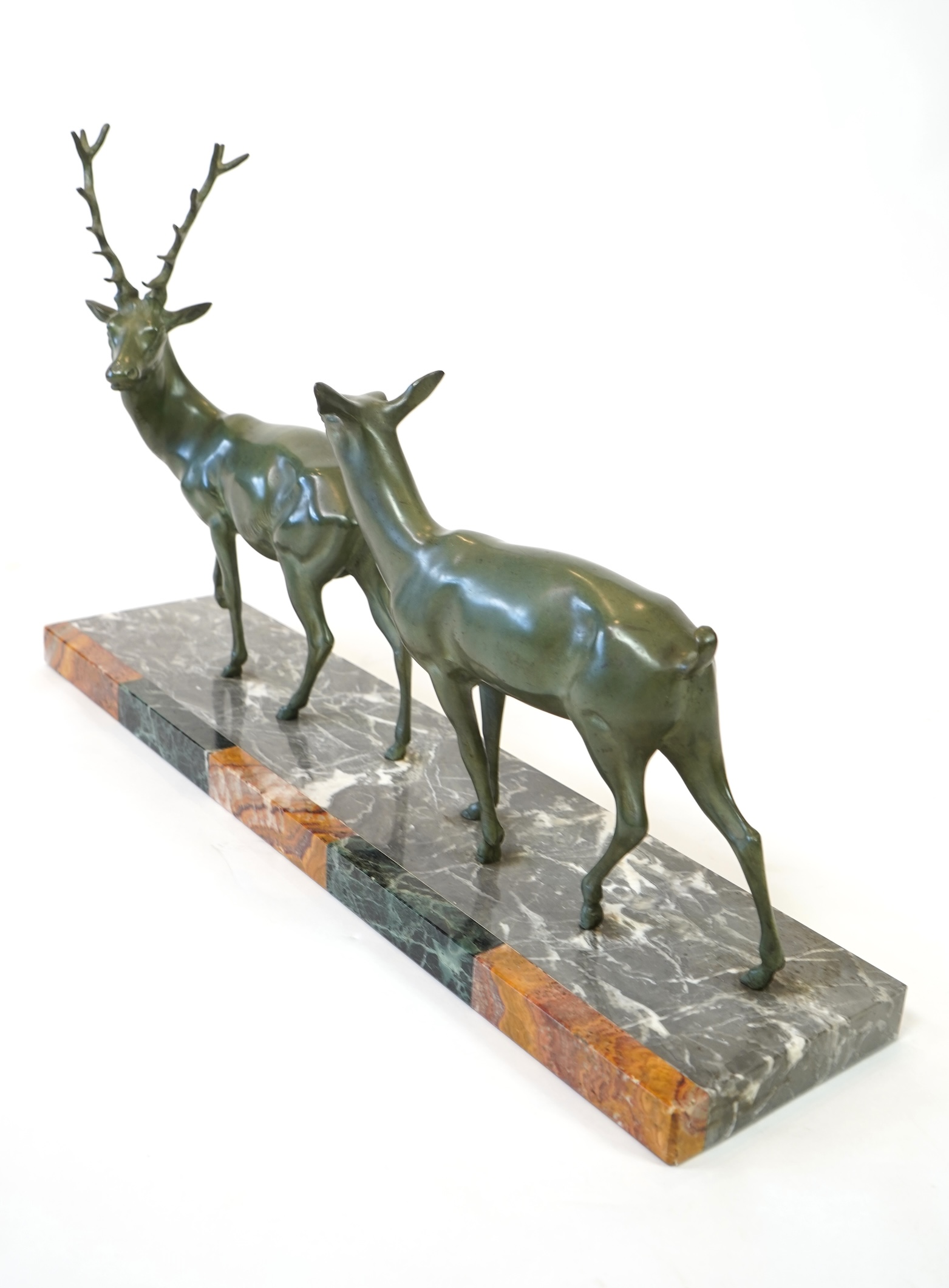 Manner of Louis-Albert Carvin, French 1875-1951, An Art Deco bronze group of a stag and doe